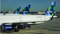 JetBlue planes at New York JFK. The airline is ending its merger plans with Spirit.