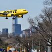 A Spirit Airlines jet approaching LaGuardia Airport.