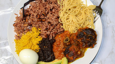Waakye, a rice and beans dish, served with shito hot pepper sauce and the works. This is a very popular meal in Ghana.