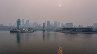 Smoke from Canadian wildfires cast a haze over Montreal on June 24. Tour operators say that conditions haven't deterred travelers from vacations in Canada.