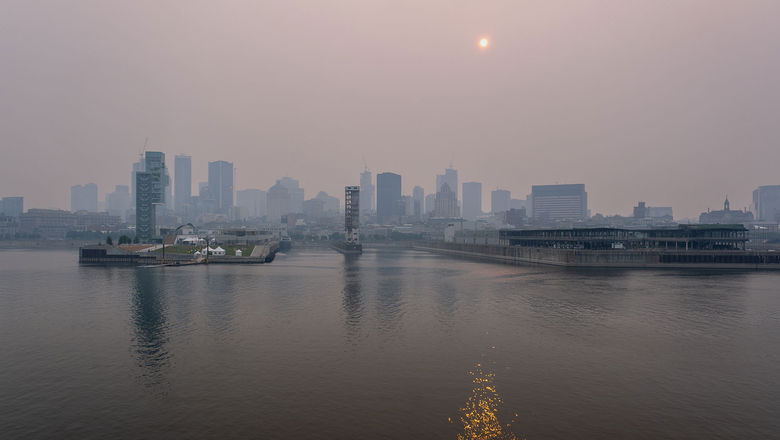 Smoke from Canadian wildfires cast a haze over Montreal on June 24. Tour operators say that conditions haven't deterred travelers from vacations in Canada.
