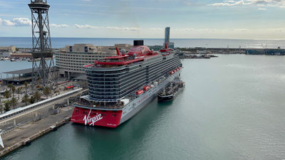 Virgin Voyages' Valiant Lady docked near Barcelona's city center in 2022, where cruise ships are no longer permitted to dock.
