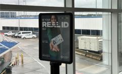 A message board at Charlotte International Airport reminding travelers to get a Real ID.