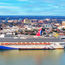 There's tariff threats and stock volatility. But Carnival Corp. says its lines are thriving