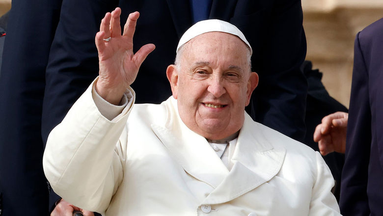 Pope Francis waves to the crowd in St. Peter's Square at the Vatican on Nov. 13, 2024.