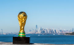 The World Cup trophy with New York in the background. The U.S., Canada and Mexico will host the 2026 tournament.