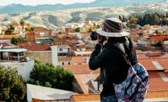 A tourist photographs the city of Sucre in Bolivia.