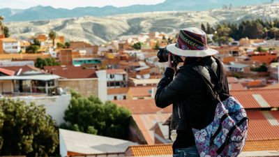 A tourist photographs the city of Sucre in Bolivia.