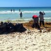 Workers remove sargassum from a beach in Playa del Carmen in April.
