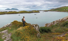 A hiker stops to take in the view in Ireland's County Kerry.