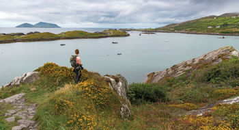 A hiker stops to take in the view in Ireland's County Kerry.