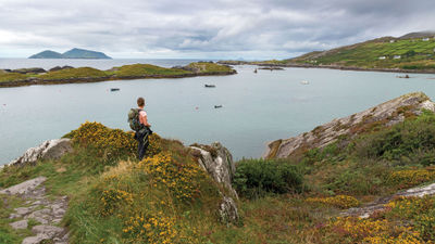 A hiker stops to take in the view in Ireland's County Kerry.