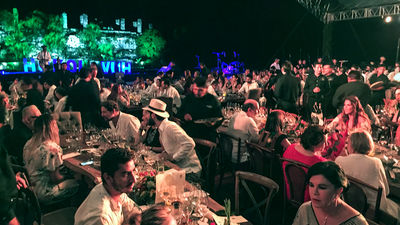 The Hokol Vuh feast underway, with the Mayan ruins of Ake in the background.