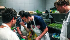 Matt Orlando, chef of Amass in Copenhagen, samples a sauce being prepared by chefs Christian Puglisi (back to camera, left) of Reloe, also in Copenhagen, and Blaine Wetzel of the Willows Inn, on Lummi Island, Wash., as Esben Holmboe Bang of Maaemo in Oslo watches.