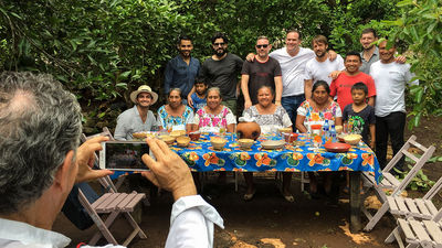 Posing with the family that had prepared their breakfast in a backyard garden are (back row, from left) Jose Luis Hinostroza of Noma in Copenhagen, Paco Mendez of Hoja Santa in Barcelona, Albert Adria of Enigma in Barcelona, Roberto Solis of Nectar in Merida, Rene Redzepi of Noma and Blaine Wetzel of the Willows Inn on Lummi Island.