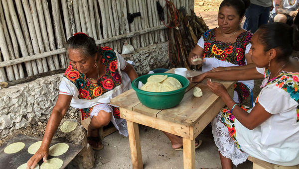 Three women in the village of Yaxunah prepare tortillas for a meal that chef Esben Holme Bang of the restaurant Maaemo in Oslo would later call "life changing." Three women in the village of Yaxunah prepare tortillas for a meal that chef Esben Holme Bang of the restaurant Maaemo in Oslo would later call "life changing."