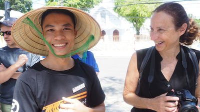 Theresa Jackson (right), owner of New York-based Enlightened Journeys Travel, chats with Hoi An native Buu, a Streets International trainee.