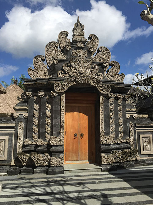 A decorative door and gate on the property. A decorative door and gate on the property.