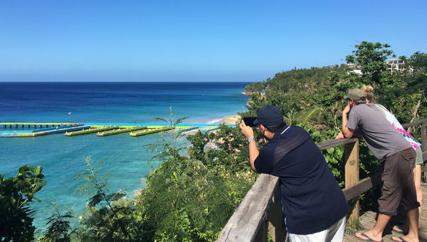 Tourists at a scenic lookout over Crash Boat Beach in Aguadilla. Tourists at a scenic lookout over Crash Boat Beach in Aguadilla.