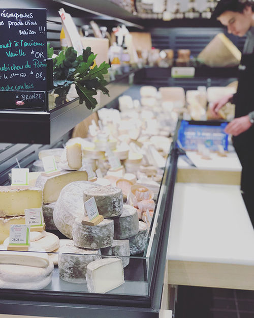 Rows upon rows of delicious-looking French cheeses were among the many gourmet delights on display at Lyon's indoor marketplace.