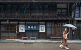 A monk makes his way through the rain in the town of Narai on the historic Nakasendo.