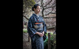 A kimono-clad participant of a Walk Japan tea ceremony led by Tea Master Soka Haneishi in a historic tea house in Ueno Park, Tokyo.