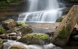 A hike through dense jungle brings visitors to a dramatic waterfall on the Okinawan island of Iriomotejima.