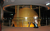 The 728-ton stabilizing damper at the Taipei 101 tower, which at roughly 1,670 feet once held the title of world's tallest building. The tower's Damper Baby mascot is depicted in a variety of souvenir-ready colors but is seen here in silver.
