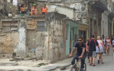 A rooftop provides a place to get one’s hair done and watch the Old Havana street scenes below.