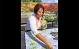 Fashion designer Mariela Aleman Orozco displayed her fabric-painting technique in Cardenas, Cuba.