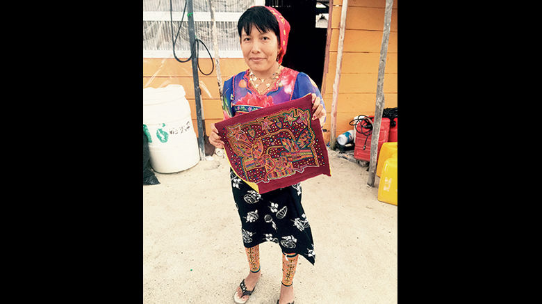 Travel Weekly editor in chief Arnie Weissmann recently spent some time in Panama's San Blas islands and wrote about his experiences and interaction with the native Kuna people there. Pictured here, a Kuna woman holds a mola she created.