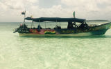 The boat that shuttled us between islands was typical of the tourist boats, including the graffiti-style graphics on its sideboards.