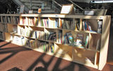 A make-shift library in the Tallinn Airport, where passengers are invited to borrow books and to contribute books.