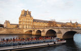 Not all tourists had vanished from Paris in the wake of the attacks, including those on this Seine River sightseeing cruise, which sailed past the Louvre at sunset.