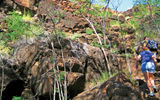 Hikers climb up to an ancient heiau, or temple, at Kaunolu, which is a National Historic Landmark. The remote Lanai district is home to some of the best preserved ancient Hawaiian shrines and temple sites across the Hawaiian Islands.