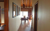 Guests enter the bungalows down a long, cool hallway, past two bedrooms and to a large, high-beamed living room and full kitchen.