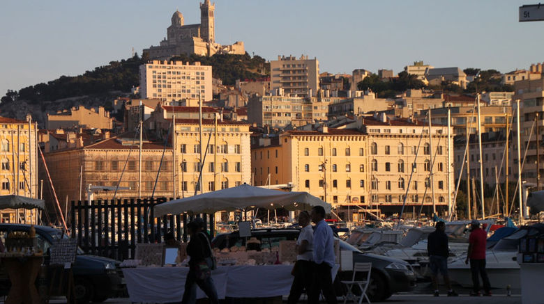 XL Airways launched seasonal nonstop New York-Marseille service in early June, giving tourists easier access to the city that is Europe's Capital of Culture this year and to all the appealing attractions in the area. Nadine Godwin, representing Travel Weekly on the inaugural service, took a look at a fast-evolving Marseille and, in the area, Avignon and Saint-Tropez. Pictured here, an evening view of Marseille's Vieux Port with the city's iconic Notre-Dame de la Garde highlighting the scene. Photos by Nadine Godwin