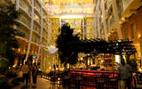 The Central Park neighborhood on the Oasis of the Seas seen lit up at night.