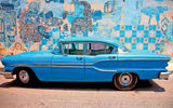 The door to Cuba is opening slowly, permitting glimpses once off-limits to U.S. travelers, thanks to the Obama administration which, in 2011, reactivated the licensed people-to-people programs begun in 2000 but quashed by Bush in 2003. Insight Cuba, which pioneered the programs in 2000, was the first company to send Americans to Cuba under the new regulations in August 2011. Shown here, a familiar scene in Havana, noted for its vintage '50s cars and its vibrant artwork. Photo courtesy of Insight Cuba.