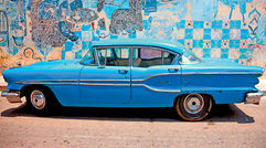 The door to Cuba is opening slowly, permitting glimpses once off-limits to U.S. travelers, thanks to the Obama administration which, in 2011, reactivated the licensed people-to-people programs begun in 2000 but quashed by Bush in 2003. Insight Cuba, which pioneered the programs in 2000, was the first company to send Americans to Cuba under the new regulations in August 2011. Shown here, a familiar scene in Havana, noted for its vintage '50s cars and its vibrant artwork. Photo courtesy of Insight Cuba.