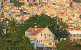 A recent trip to Haiti offered a brief glimpse into a country intent on moving forward out of poverty and the damage of the January 2010 earthquake into a tourist destination offering Creole culture, crafts and cuisine plus music and mountains, beaches and boutique hotels and art and architecture. Pictured here, early morning sunlight brightens the hillsides of Petion-Ville, a suburb of Port-au-Prince. Photo by Melanie Reffes