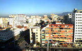 While no one was looking, Albania transformed itself into a destination with considerable appeal for American tourists. Reporter Nadine Godwin traveled to the country recently for a first-hand look at its appeal. Shown here, colorful buildings in Albania's capital city, Tirana.