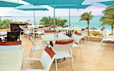 One of the village's three al fresco eateries, Sky Lounge, is located on the roof above Bayside and open for breakfast and dinner, offering Italian and seafood specialties with sweeping views of Grace Bay Beach.