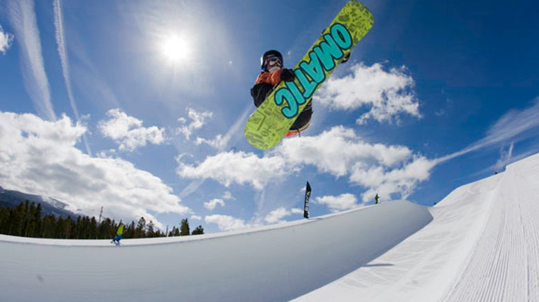 A snowboarder in a terrain park at Breckenridge Ski Resort.