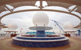 A pool is built around a satellite dome in an adults-only section of the Fantasy.