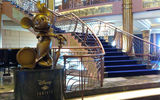A bronze statue of Minnie Mouse stands in the ship's three-deck high atrium lobby.