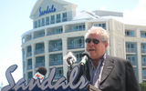 Sandals Chairman Butch Stewart stands in front of the remodeled Balmoral Tower.