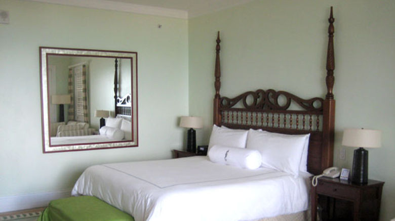 Oceanfront guestrooms at Sandals Emerald Bay open onto the beach; other rooms offer views of the beach and sea.