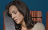 TravelRest Pillow. The elongated inflatable pillow -- no horseshoe-shaped collar here -- comes with a tether that helps secure it to your body, to a seat headrest or to a seat itself.