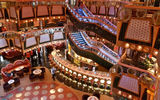 With its Vegas-style decor, the Carnival Splendor's multi-deck atrium is the first space guests see when boarding the ship. Photo by Peter Knego/www.maritimematters.com